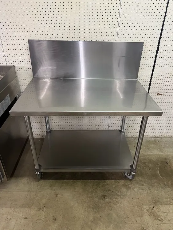 Used Falcon Restaurant Supply Used 48"X30" Stainless Table with 16" Backsplash on Casters - FG Food Prep Tables Illinois US | Falcon Restaurant Supply #1375231
