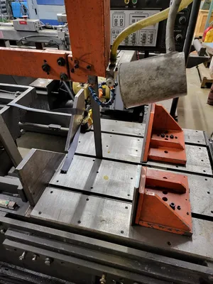 HE&M Vertical Bandsaw V100LM-45 with Infeed/Outfeed Conveyors
