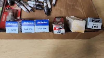 Mixed Brand Spark Plugs and Cleaner Lot including E3, AC Delco, and Champion