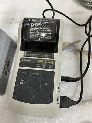 Mitutoyo model 7004 thickness tester with Mitutoyo model DP-1VR Digimatic mini processor printer