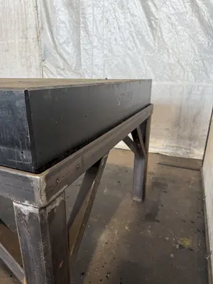 50" X 124" DRILLED & TAPPED STEEL LAYOUT TABLE W/ STAND. STOCK # 0667025.