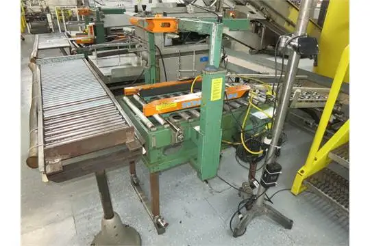 Signode case sealer, top/bottom seal w/ roller conveyors