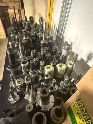 150PC CNC TOOLING LOT: CAT40/50, BT40/50, HSK63, COLLET, END MILL, SHRINK-FIT, BORING HEADS