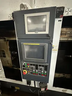 Used FUJI ANW 35 TWIN TURRET CNC LATHE, TAIL STOCK WITH ROBOT LOAD/UNLOAD AND STOCKER TABLES CNC Lathes | Harbor Machinery Inc. #1283396