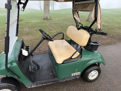 (1) 2015 E-Z-Go golf cart with a Kawasaki gas engine, includes canopy, ball cover, club cover, fold-...