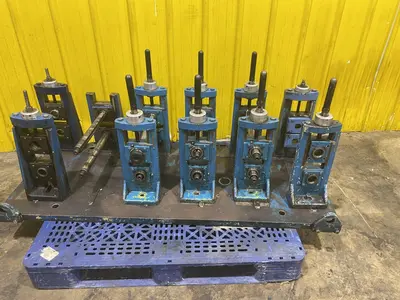 4 STAND X 1.5" X 11" YODER ROLLFORMER STANDS ON 6 STAND RAFTED BASE: STOCK #16781