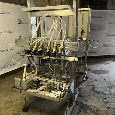 6 Head ELF Filler with feed tanks & container link belt conveyor