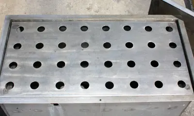 SPC7647  Miscellaneous Equipment bottle dump station Stainless Steel 28 each 1-3/8" diameter holes, 16"W x 32"L x 15 3/4"D