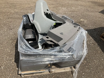 Skid of Kenworth interior parts including dash panels and sleeper cab components, used