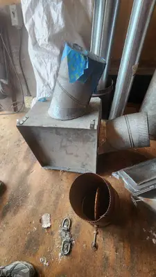 Various HVAC Ductwork Pieces and Accessories including Pipe, Elbows, and Connectors