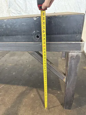 50" X 124" DRILLED & TAPPED STEEL LAYOUT TABLE W/ STAND. STOCK # 0667025.