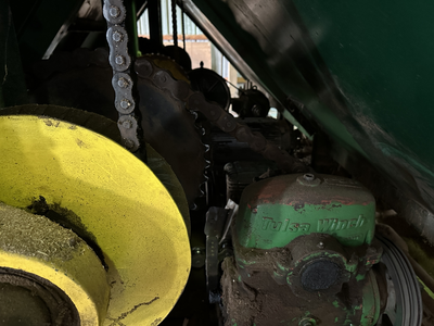 6 strand, 120' green chain with incoming deck and hoist. 24 heavy duty carts