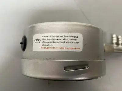 USED ACROSS INTERNATIONAL STAINLESS STEEL VACUUM GAUGE W/ 1/2" CONNECTION