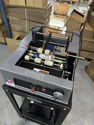Advent model 310 semi-automatic pressure sensitive wraparound labeler