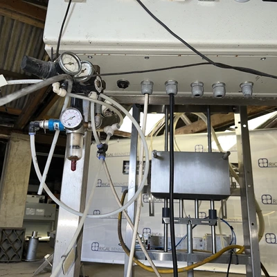 6 Head ELF Filler with feed tanks & container link belt conveyor