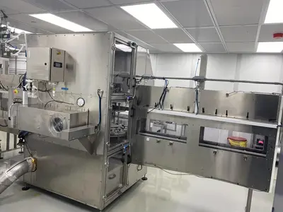 Inline Filling Systems Net-Weight Rotary Jar Filler with Integrated Capping for Clean Room Application in Semi-Conductor Industry, 2009
