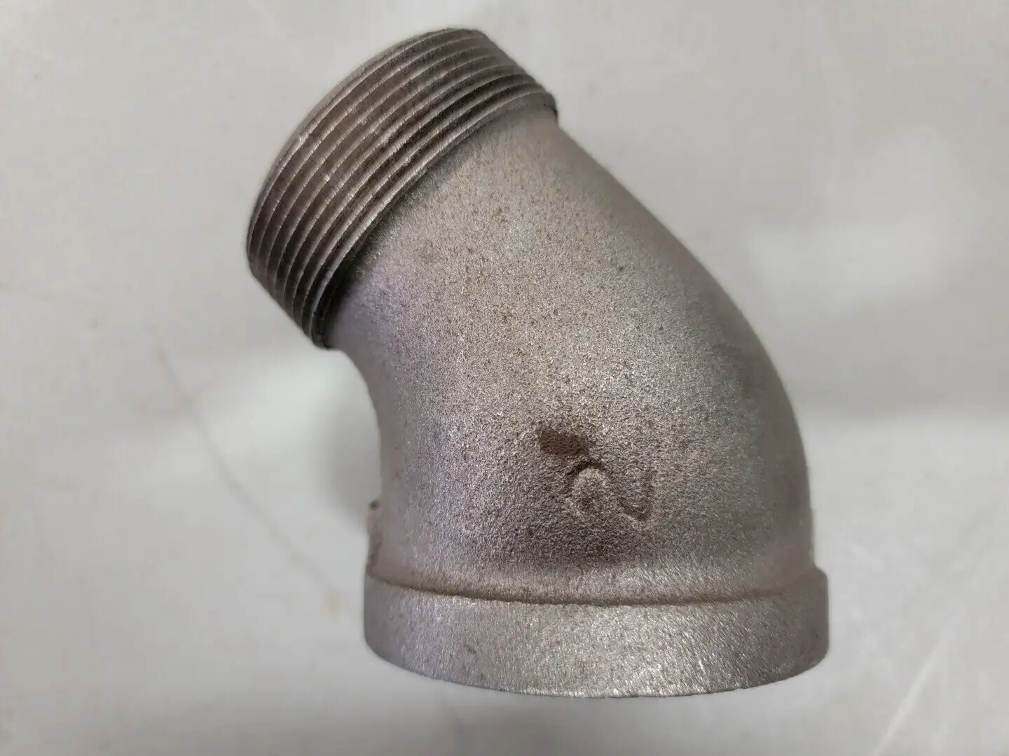 2" Female x 2" Male 45 Deg Elbow Pipe Fitting, Black Malleable Iron