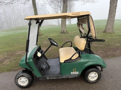 (1) 2017 E-Z-Go golf cart with a Kawasaki gas engine, model 625111G01, includes canopy, ball cover, ...