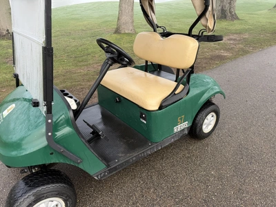 (1) 2017 E-Z-Go golf cart with a Kawasaki gas engine, model 625111G01, includes canopy, ball cover, ...