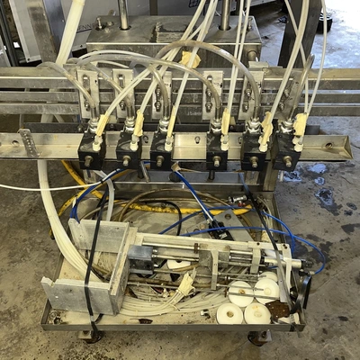 6 Head ELF Filler with feed tanks & container link belt conveyor