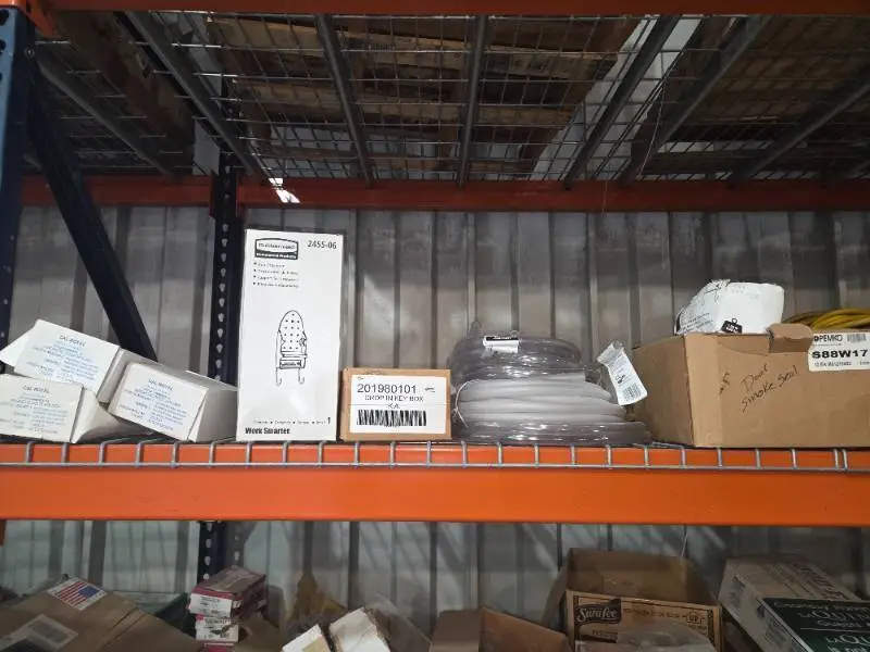 Shelf of magnetic door holders, hose, cords