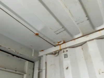 20’ Shipping / Storage Container 8’ wide x 8’ 6” tall, swing doors on one end, wood deck, rings for ...