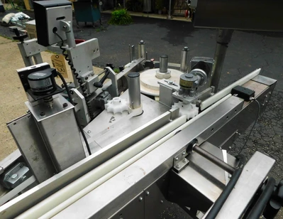 USED NEWMAN WRAP AROUND LABELER NV II