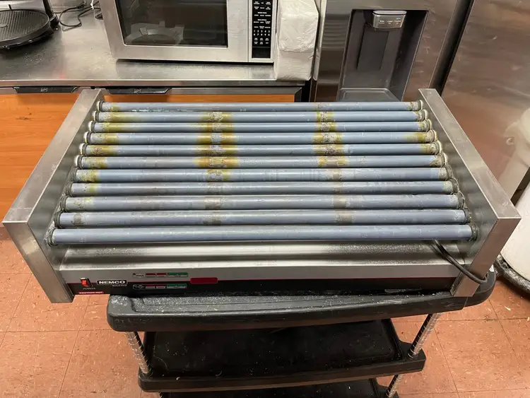 Used Nemco Used Nemco 8250SX-SLT Digital Hot Dog Roller Grill 50 Hot Dog Capacity 120V AS IS Grills & Griddles Illinois US | Falcon Restaurant Supply #1376233