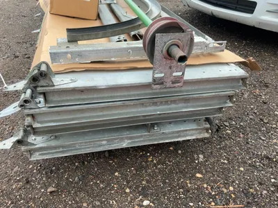 Used 8’ Tall x 10’ Wide Insulated Roll Up Door, comes with tracks, spring, and hardware, four panels...