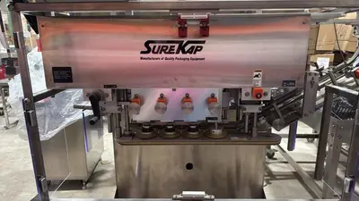 USED SUREKAP MODEL SK8000-BF6-70 AUTOMATIC SPINDLE CAPPER SUREKAP MODEL SK8000-BF6-70 AUTOMATIC SPINDLE CAPPER