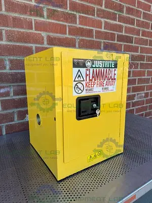 USED JUSTRITE 4 GALLON FLAMMABLE LIQUID STORAGE CABINET W/ SOFT CLOSE DOORS, KEY