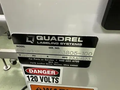 Quadrel model Q110 pressure sensitive wraparound labeler