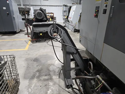 Hyundai HI-V50D VMC w/ 30-Slot ATC, Conveyor, (2) Kurt Vise, Fanuc Oi-MC Controller