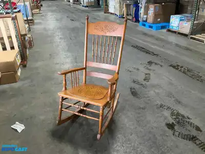 Lot of (2) wooden rocking chairs- brown press back oak rocking chair & black Boston rocker...