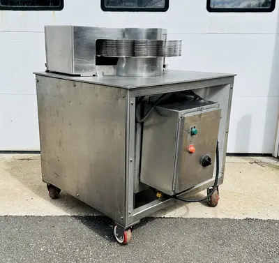 USED URSCHEL 10 STATION SEMI-AUTOMATIC ROTATING ONION SLICER