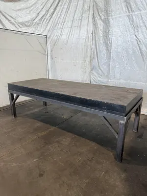 50" X 124" DRILLED & TAPPED STEEL LAYOUT TABLE W/ STAND. STOCK # 0667025.