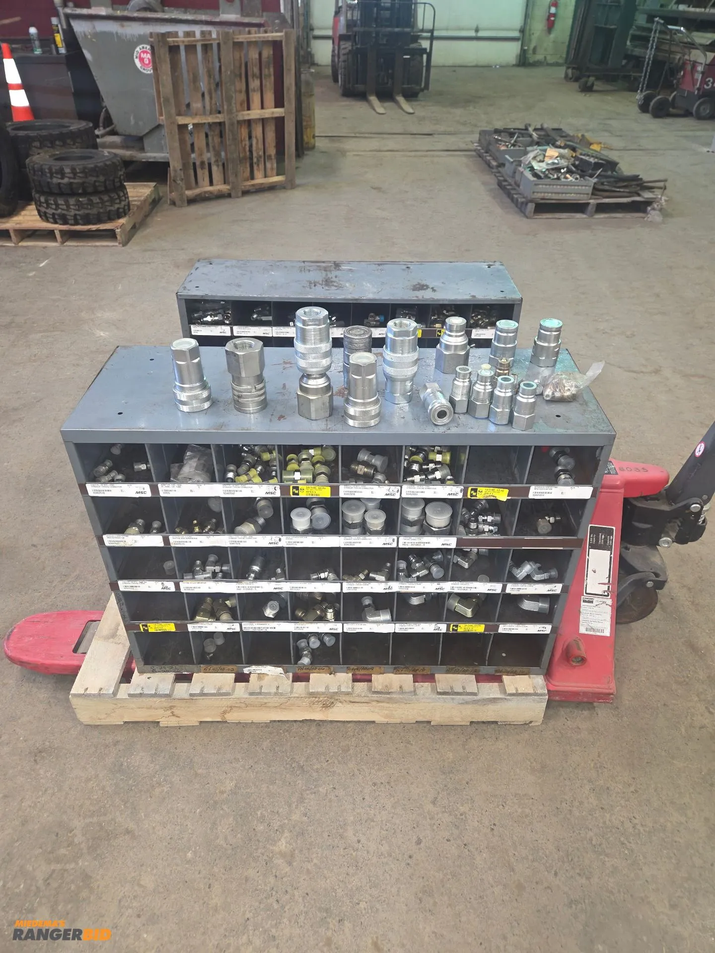 Storage bins full of Hydraulic adapters/quick disconnect fittings