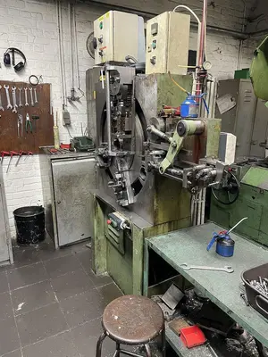 USED BUCH DCM-200 4/40 SPRING MAKING