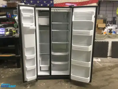 USED GE STAINLESS STEEL AND BLACK SIDE X SIDE REFRIGERATOR HEAVY DUTY ENERGY STAR