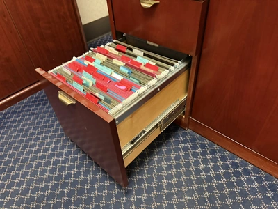 Contents of office furniture, includes (1) wood desk with glass top, 71" x 36", (1) wood credenza wi...
