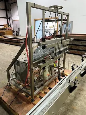 USED APEX FILLING SYSTEMS POF-12 12 SPOUT PRESSURE LIQUID FILLER