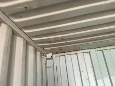 20’ Shipping / Storage Container 8’ wide x 8’ 6” tall, swing doors on one end, wood deck, rings for ...