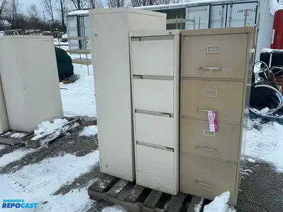Lot of (2) metal filing cabinets including a 15”x29”x52” cabinet with 4 drawers and a 15”x29”x59”...