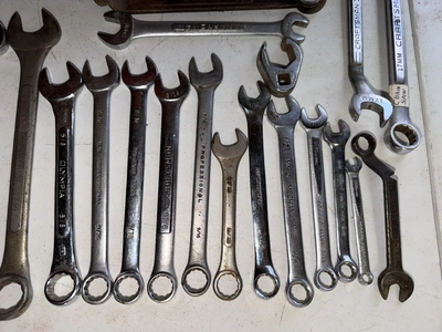(1) tool box filled with assorted box end wrenches.