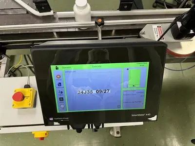 Quadrel model Q110 pressure sensitive wraparound labeler