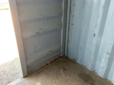 20’ Shipping / Storage Container 8’ wide x 8’ 6” tall, swing doors on one end, wood deck, rings for ...