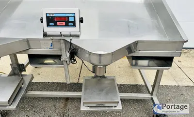 USED HEINZEN MANUFACTURING INTERNATIONAL 2720 MANUAL PACKING TABLE W/ DUAL SCALES