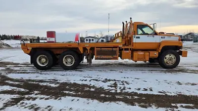 USED 2000 GMC C8500 TANDEM AXLE BED TRUCK