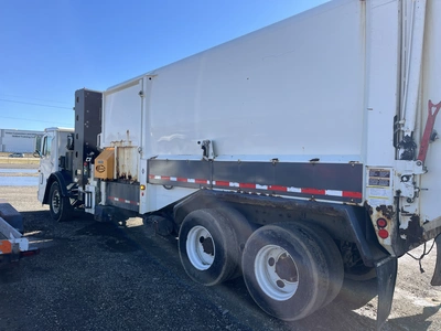 USED 2013 MACK LEU633 REFUSE PACKER BODY WITH AUTO ARM.