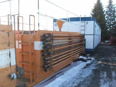 USED 20 M3 (120 BBL) SKID MOUNTED 2 COMPARTMENT MUD TANK